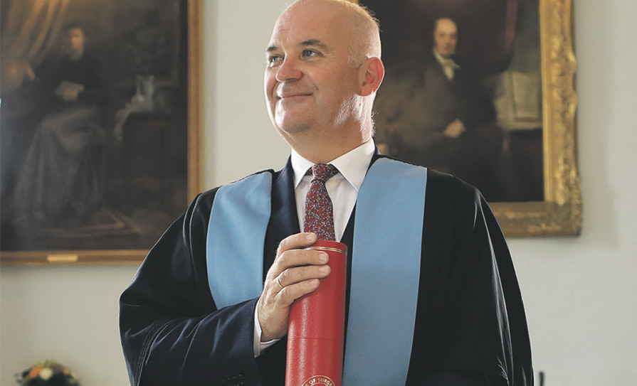 Dr Tony Holohan with his Honorary Fellowship from the RCSI Photo: Julien Behal Photography
